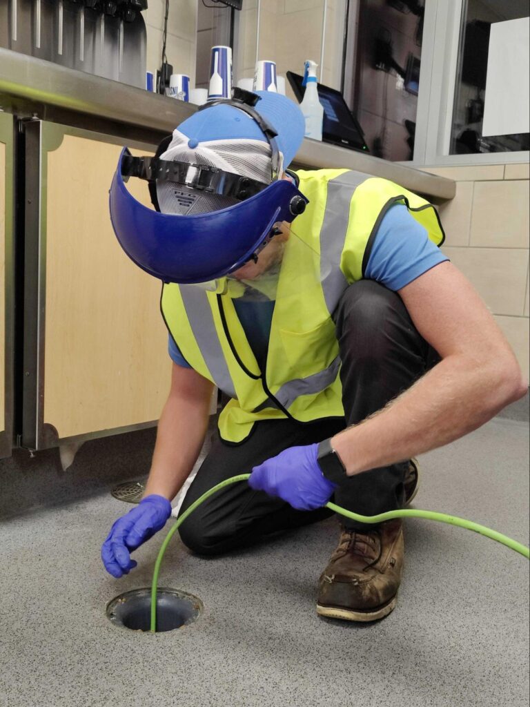 Jetting out a drain in a restaurant