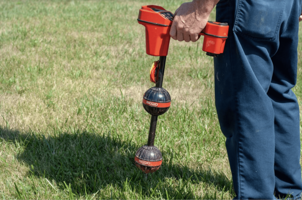 Locating subsurface location of transmitter in camera head