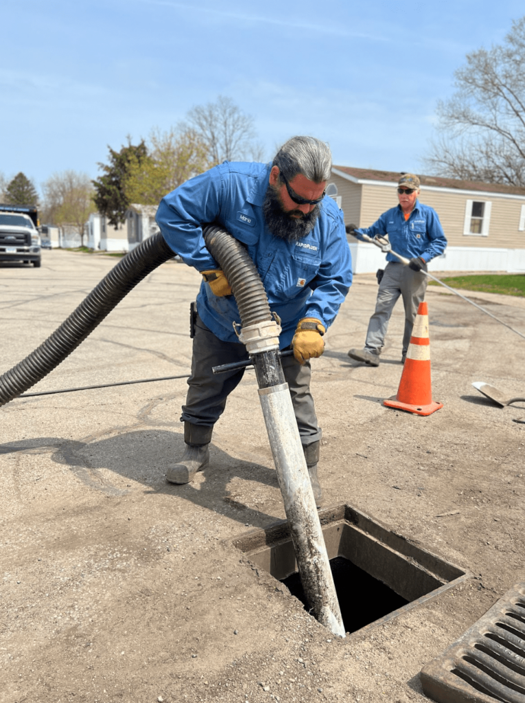 Hydro-excavating a clogged storm drain.